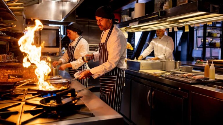 Chefs cooking on commercial cooking equipment