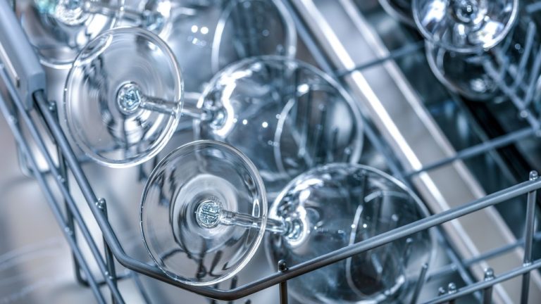 Wine glasses in a commercial glass washer